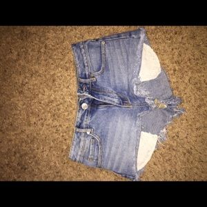 High waisted distressed cut off jeans